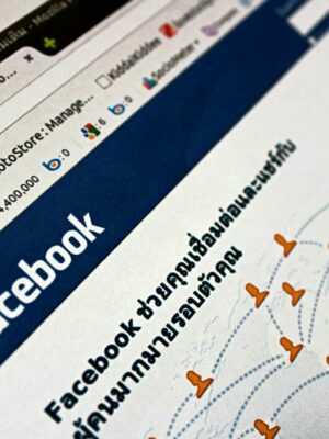 Close-up view of a Facebook webpage displayed on a browser with social media icons.